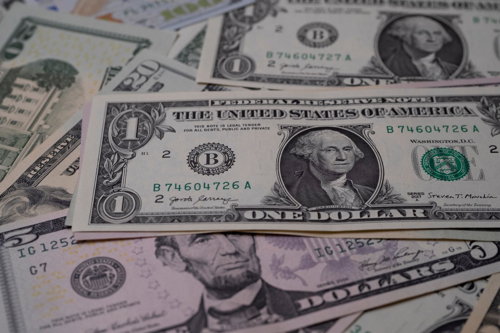 U.S. dollar bills in several denominations spread out